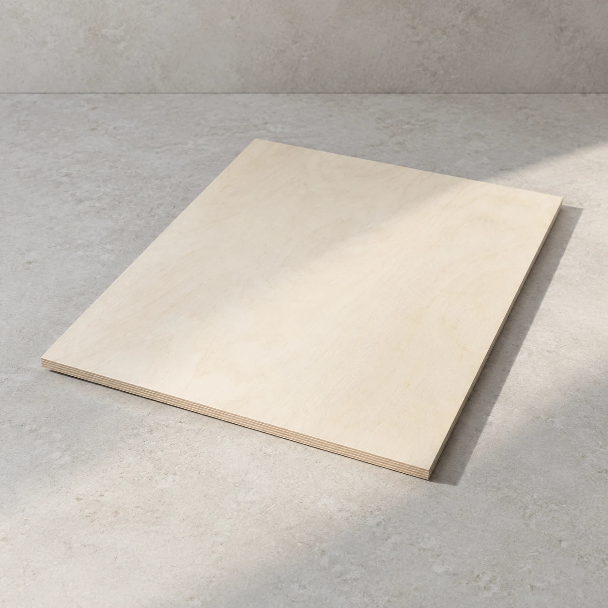 Whole poplar-faced plywood sheet on limestone, plain pale cream-white face